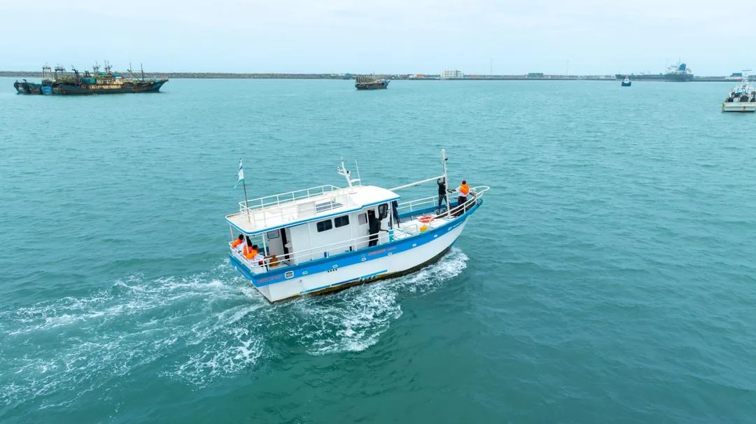 Sommarine vessel crossing clear coastal water